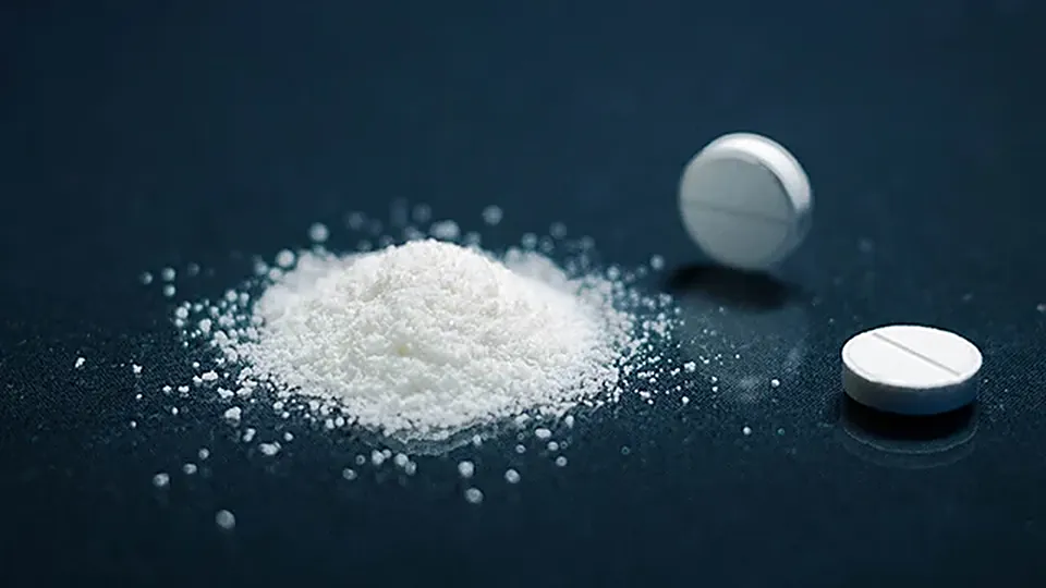 Active pharmaceutical ingredient powder with two tablets