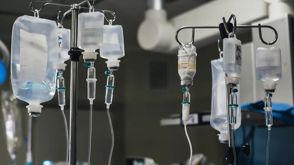 Intravenous fluid bags hanging on infusion stands