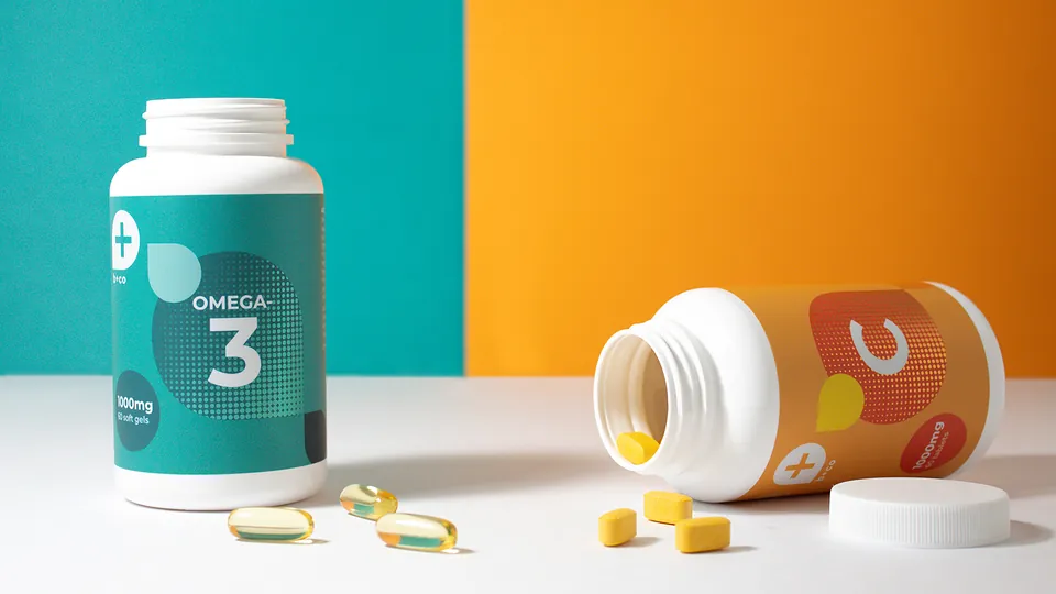 Omega-3 and vitamin C supplement bottles with softgels and tablets
